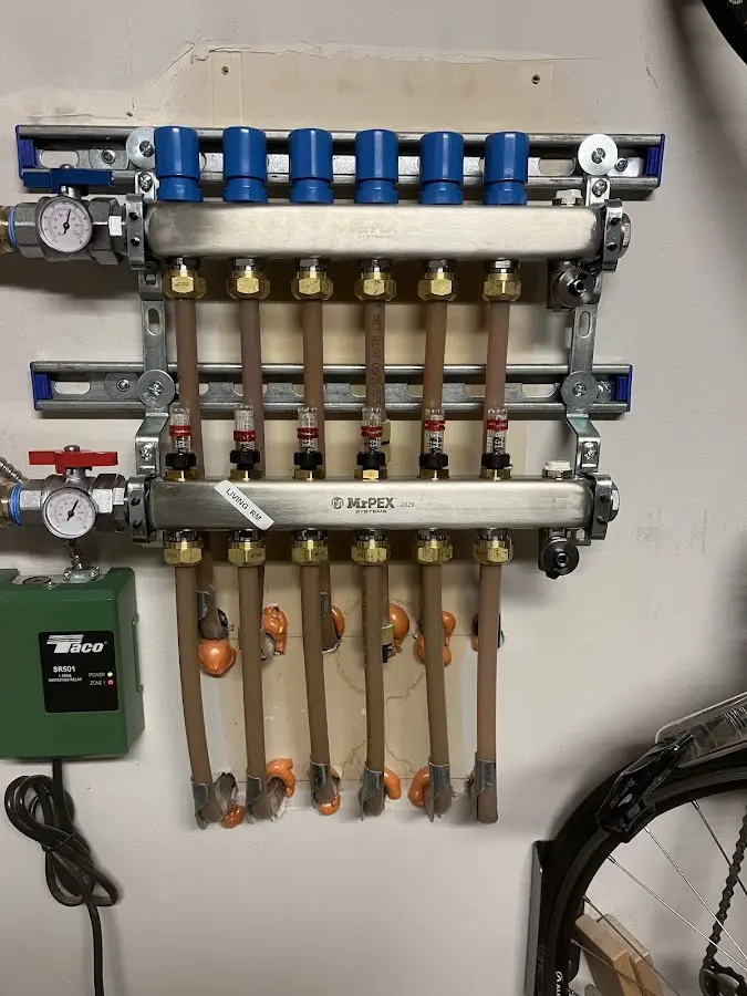 Plumber performing Water Heater Repair at a residential property in Spencer